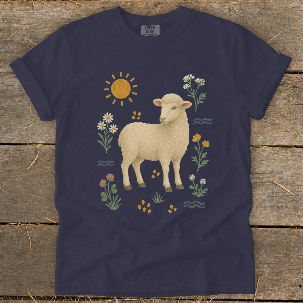 Navy t-shirt with a cream sheep illustration surrounded by flowers and a sun.