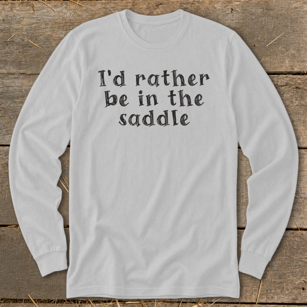White long-sleeved shirt with black text reading "I'd rather be in the saddle."
