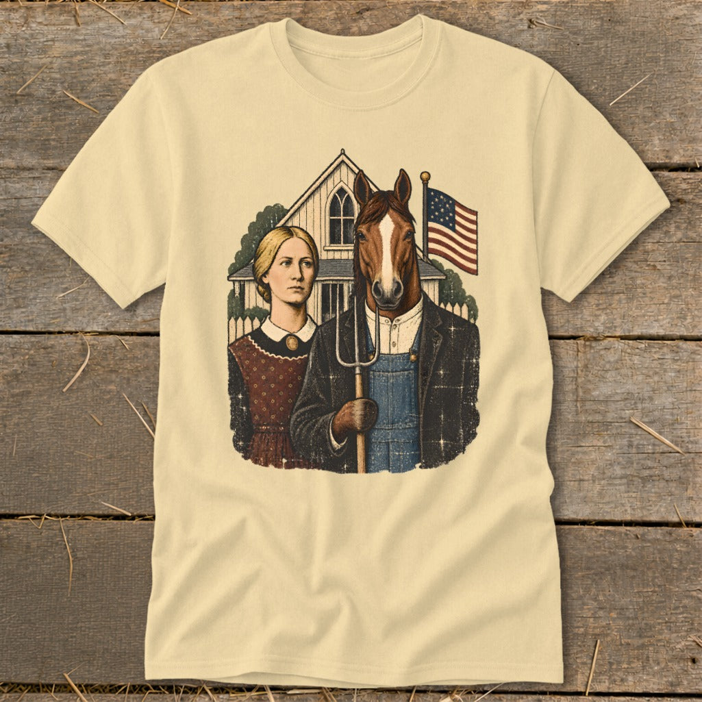 Beige t-shirt featuring a vintage American Gothic parody illustration with a horse-headed man holding a pitchfork.
