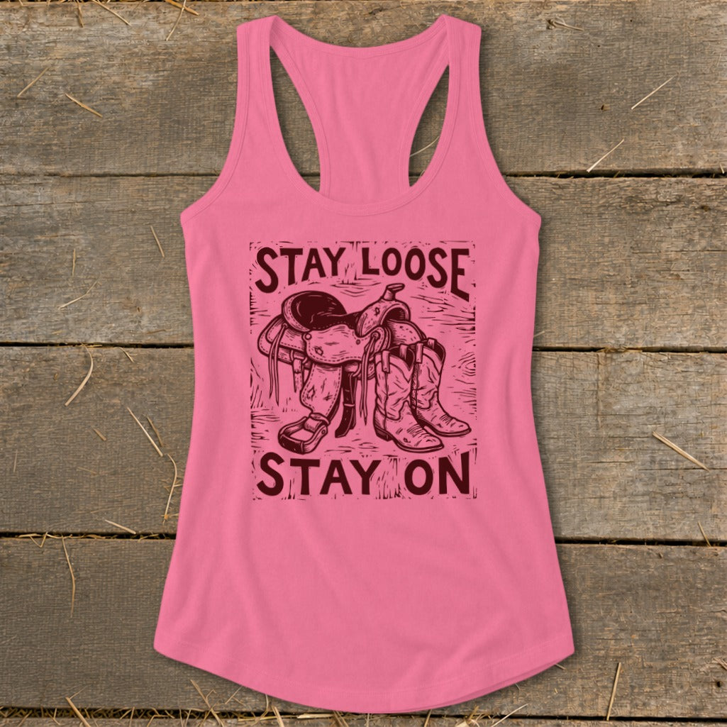 Pink tank top with "STAY LOOSE STAY ON" text and cowboy saddle and boots graphic.