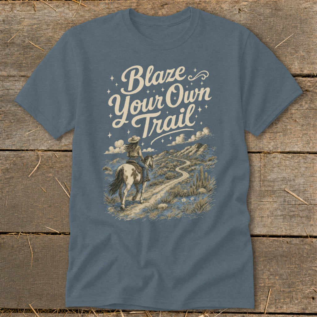 T-shirt with "Blaze Your Own Trail" text and graphic of a person riding a horse.