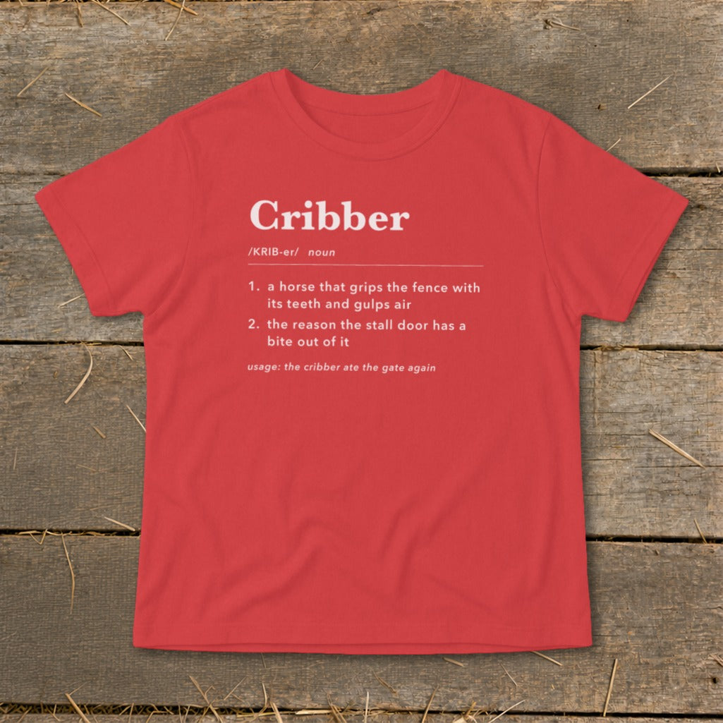 Red t-shirt featuring a dictionary definition graphic for the word Cribber printed in white on the front.