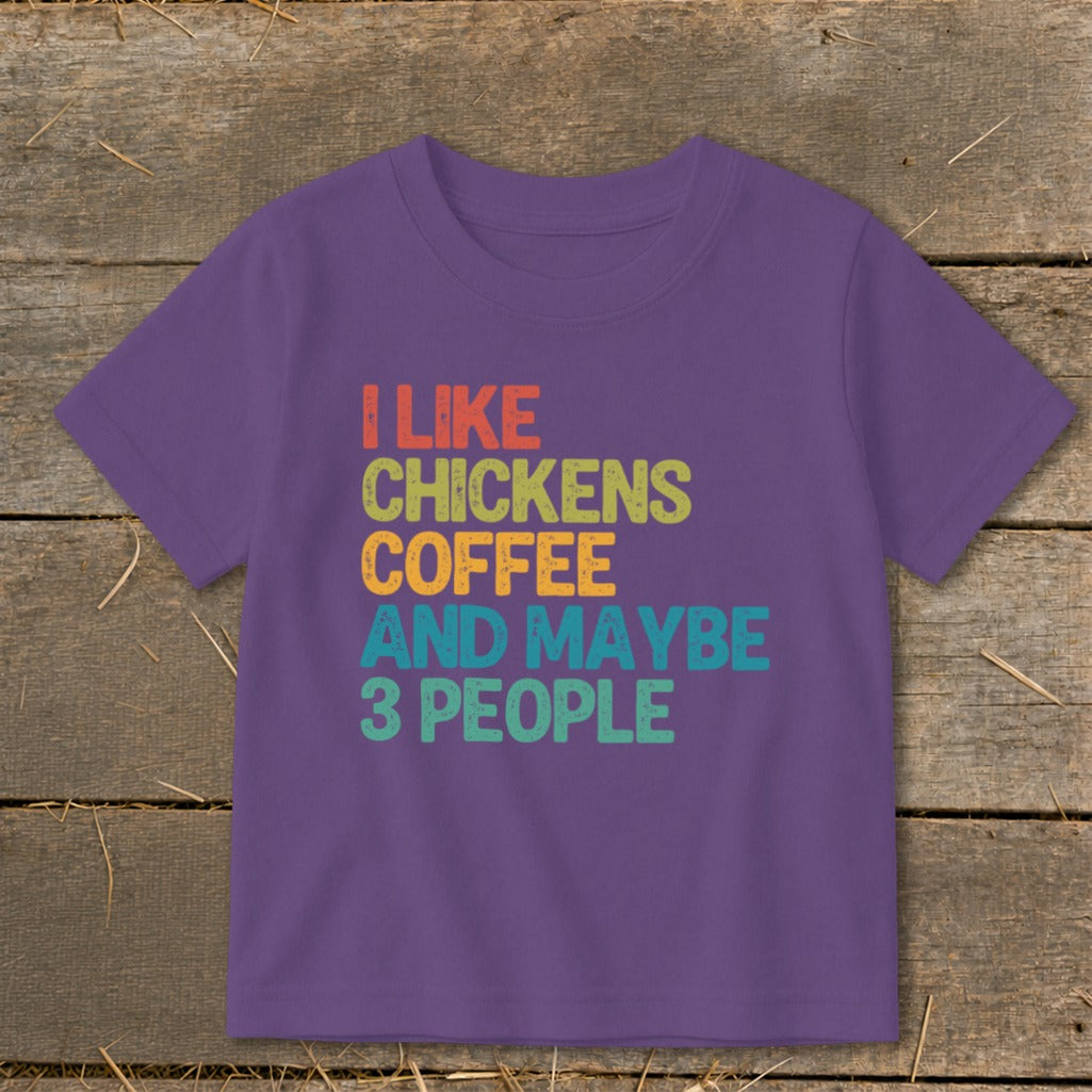 Purple t-shirt with text "I LIKE CHICKENS COFFEE AND MAYBE 3 PEOPLE".