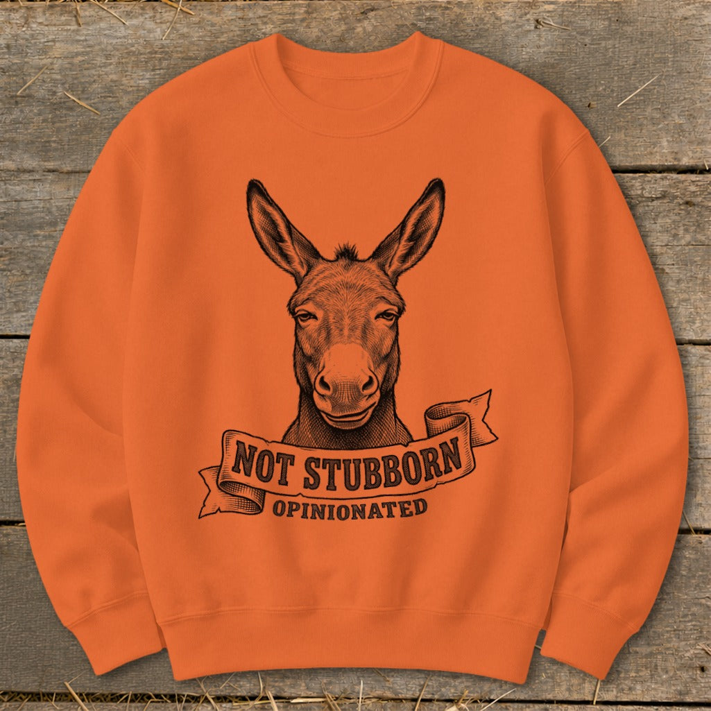 Orange sweatshirt with a donkey head graphic and text "Not Stubborn, Opinionated".