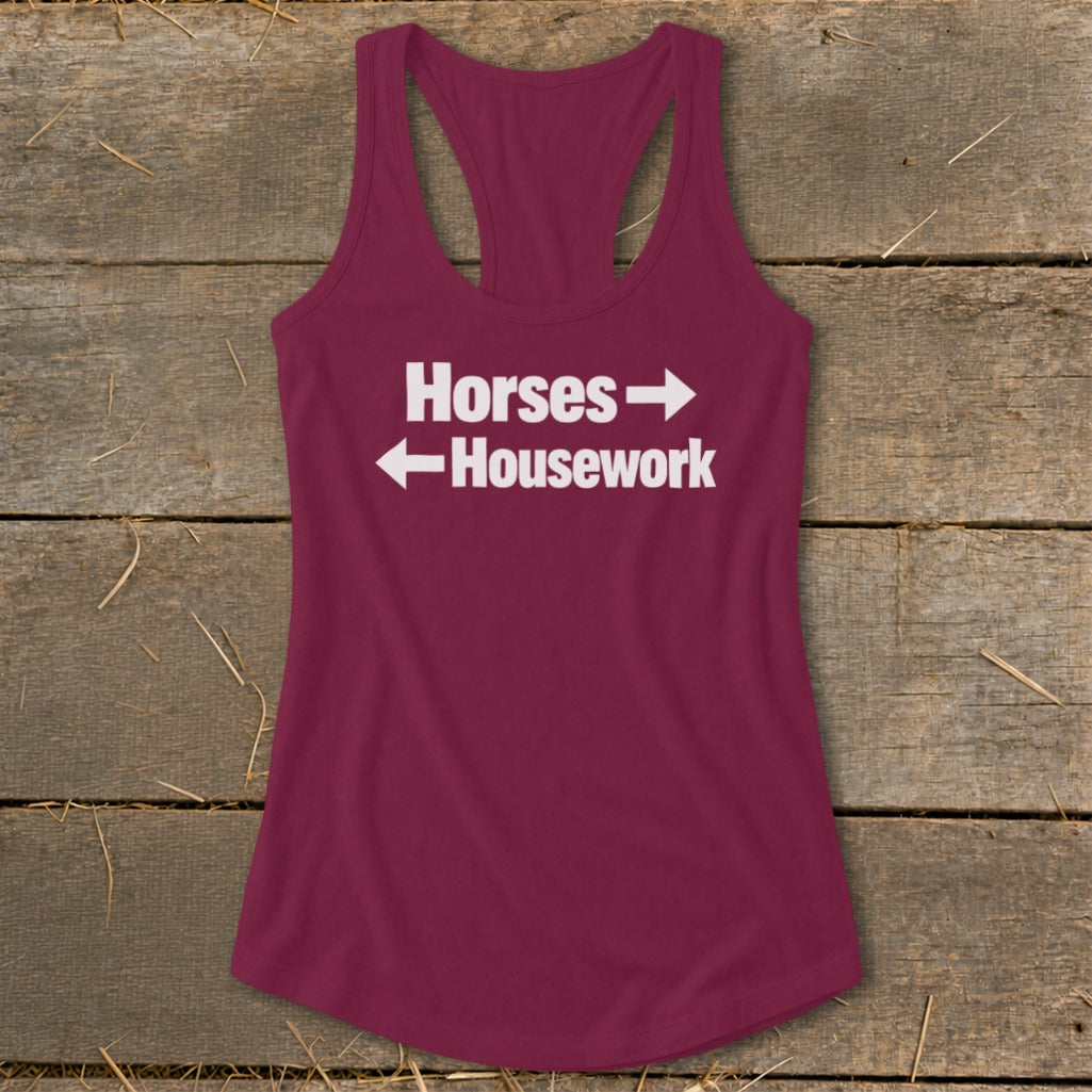 Maroon women's racerback tank top featuring the white text "Horses" pointing right and "Housework" pointing left.