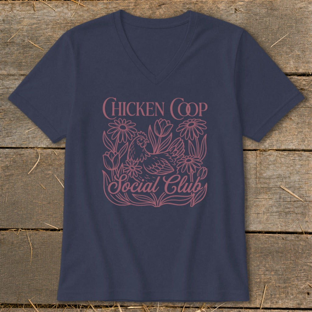 Navy v-neck t-shirt with a pink floral design and text "Chicken Coop Social Club."