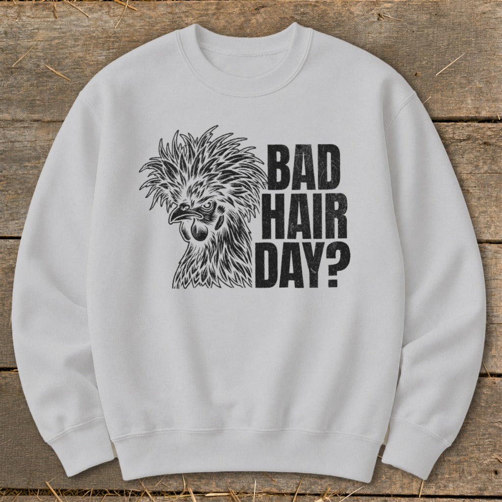 White sweatshirt with a black graphic of a chicken and text "BAD HAIR DAY?".