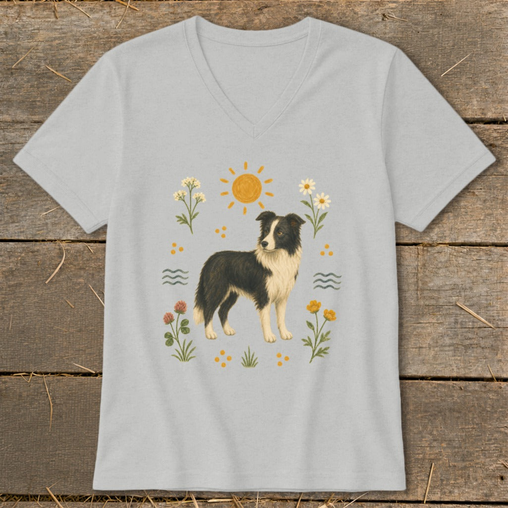 Light gray t-shirt with a black and white dog surrounded by flowers and sun.