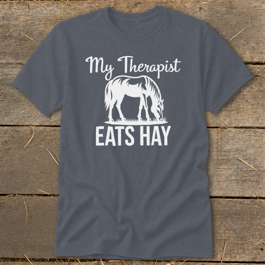 Dark gray t-shirt with white graphic of a horse eating hay and text "My Therapist Eats Hay".