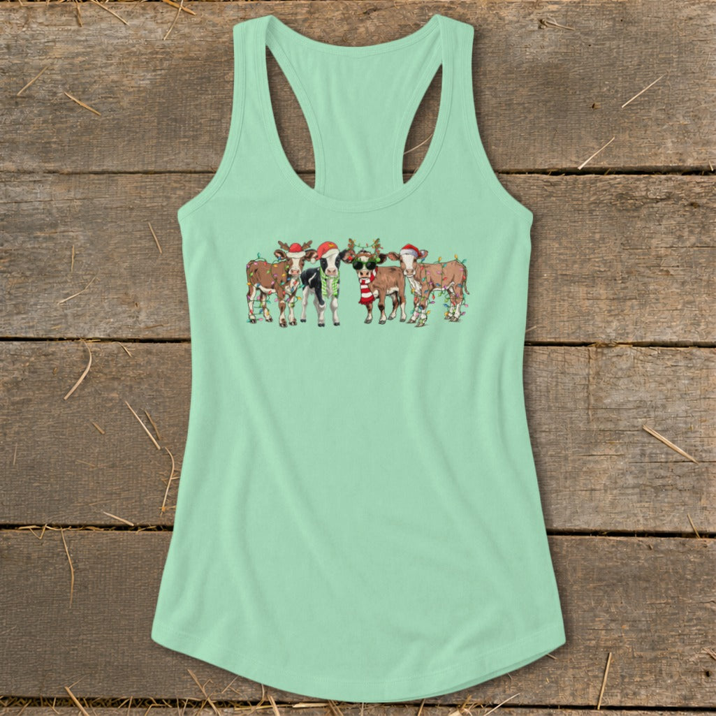 Mint green tank top with Christmas cows wearing Santa hats and holiday lights.