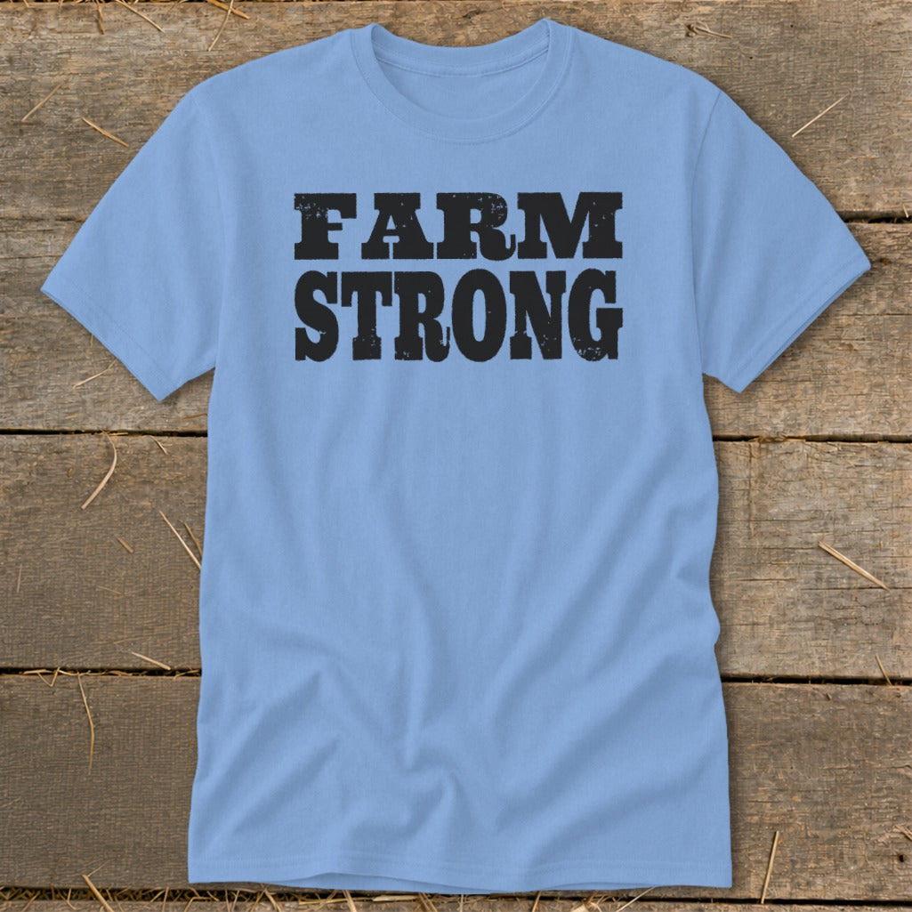 A light blue short-sleeved t-shirt with the words "FARM STRONG" printed in distressed black text.