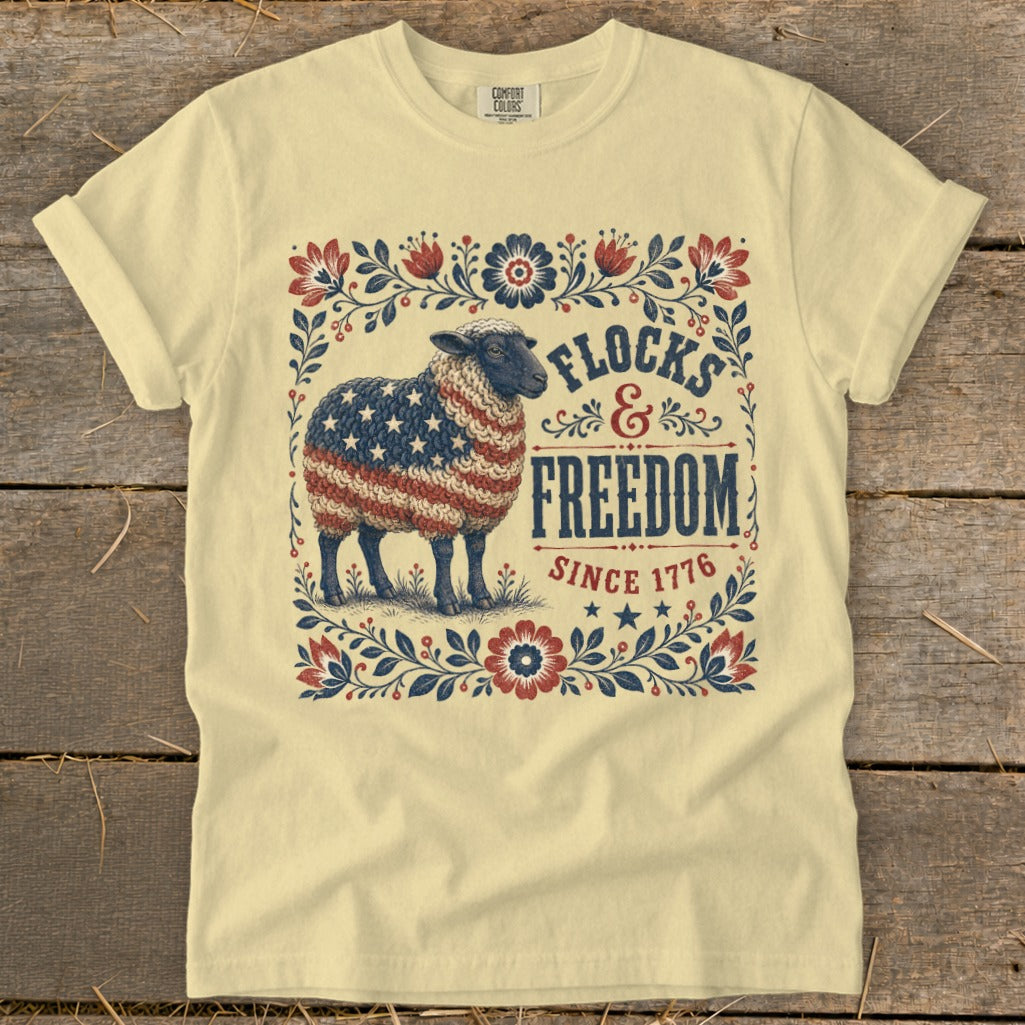 Sheep with American flag fleece and "Frocks & Freedom Since 1776" text.