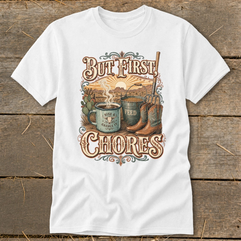 White t-shirt graphic with "But First, CHORES" text, coffee mug, feed bucket, and boots.