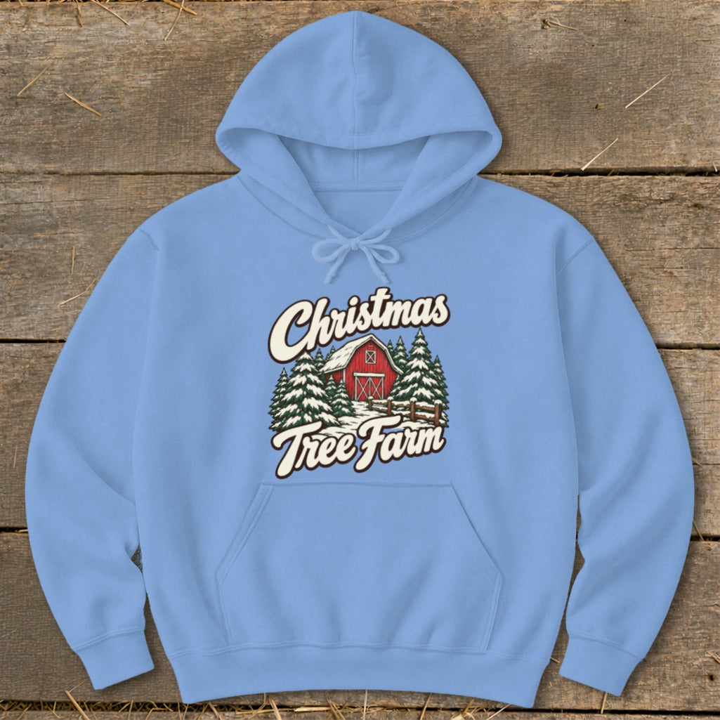 Light blue hoodie with "Christmas Tree Farm" graphic featuring a red barn and pine trees.