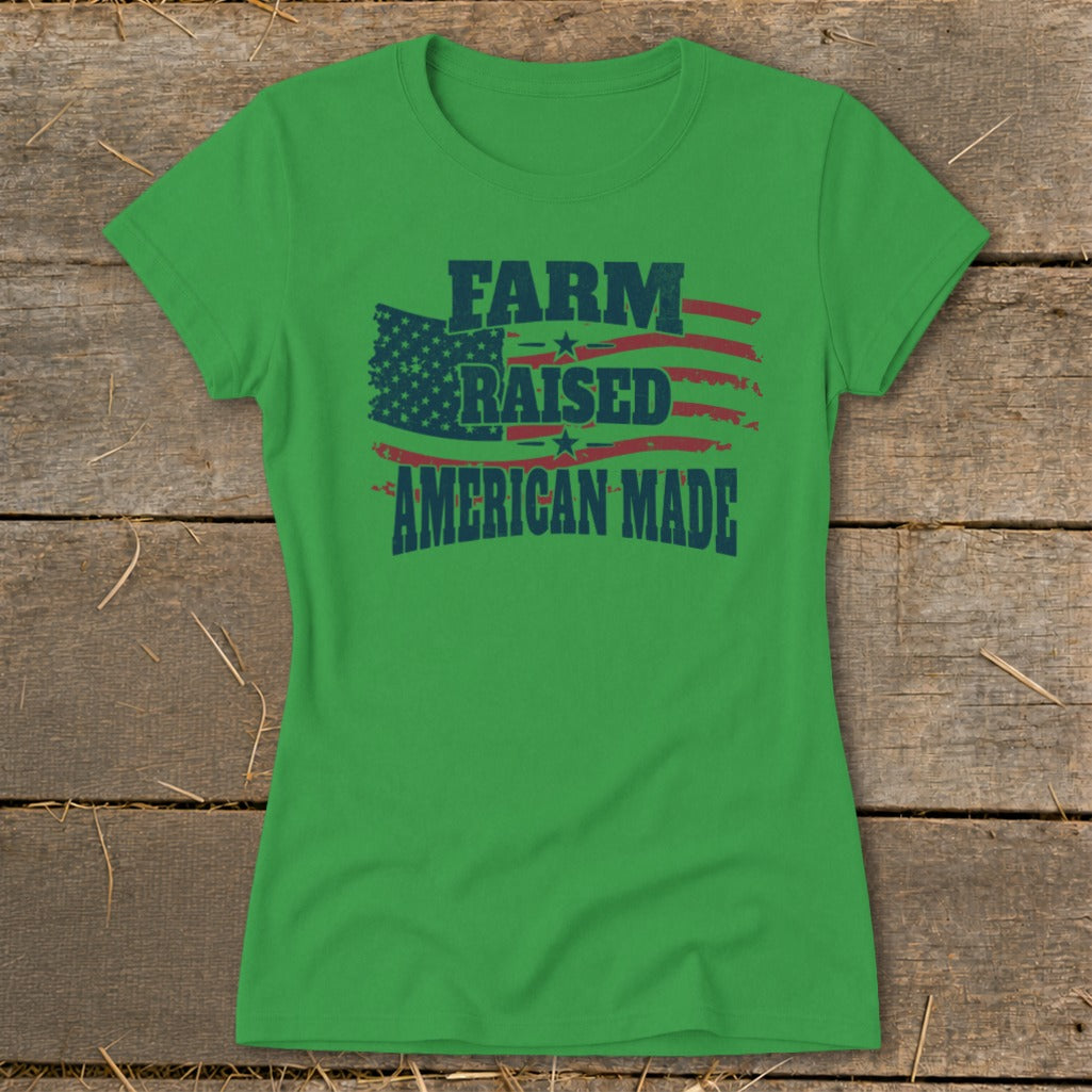 Green t-shirt with distressed "FARM RAISED AMERICAN MADE" text over an American flag design.
