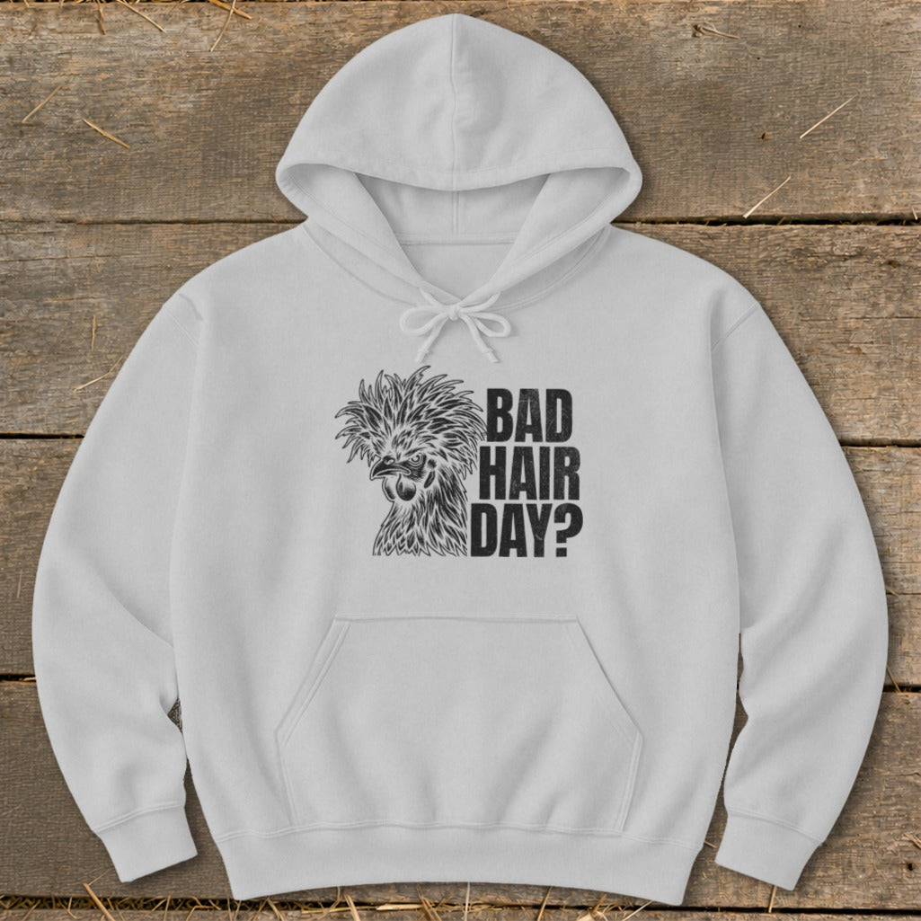 White hoodie with black graphic of a fluffy chicken and text "BAD HAIR DAY?"