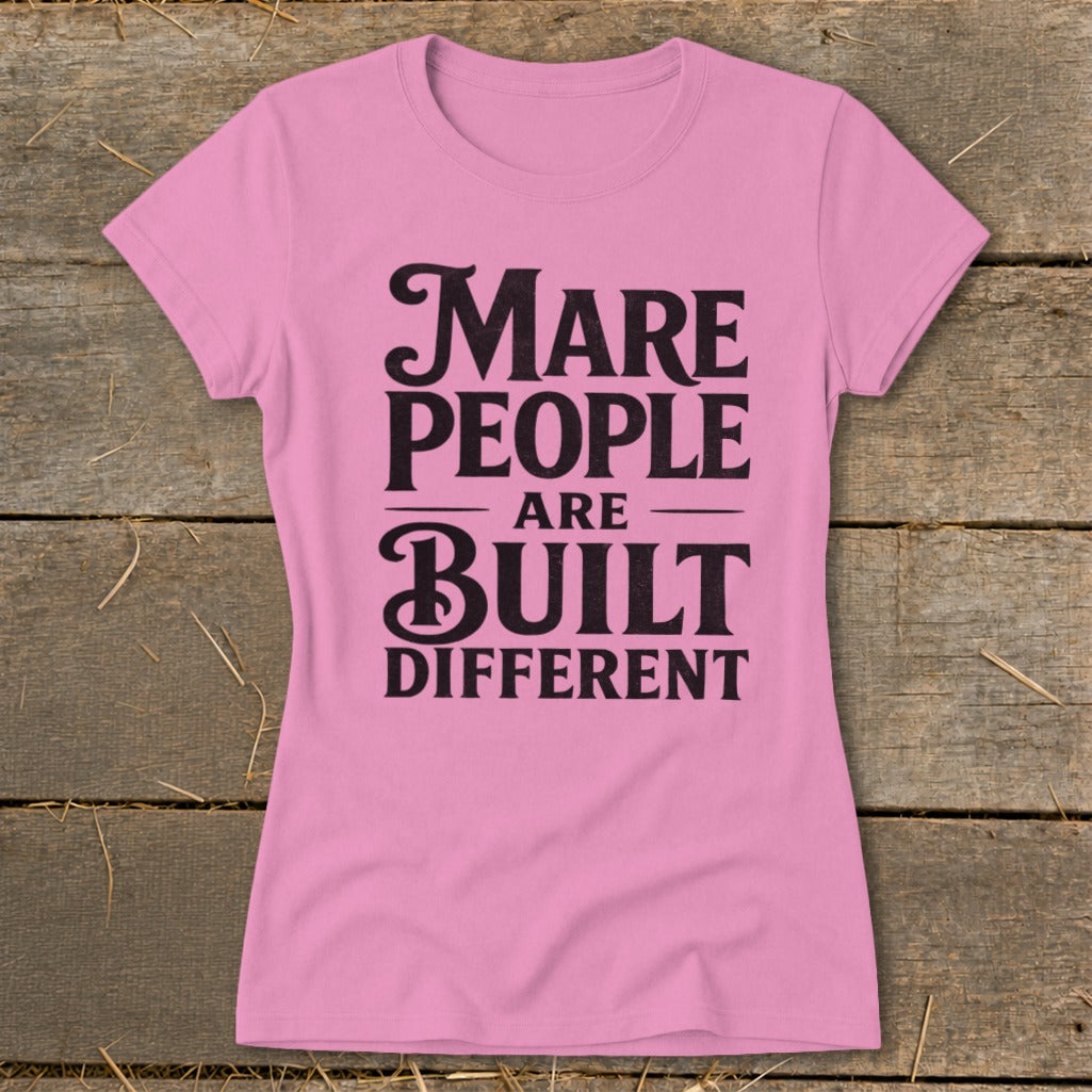 Pink t-shirt with "Mare People Are Built Different" text in black.