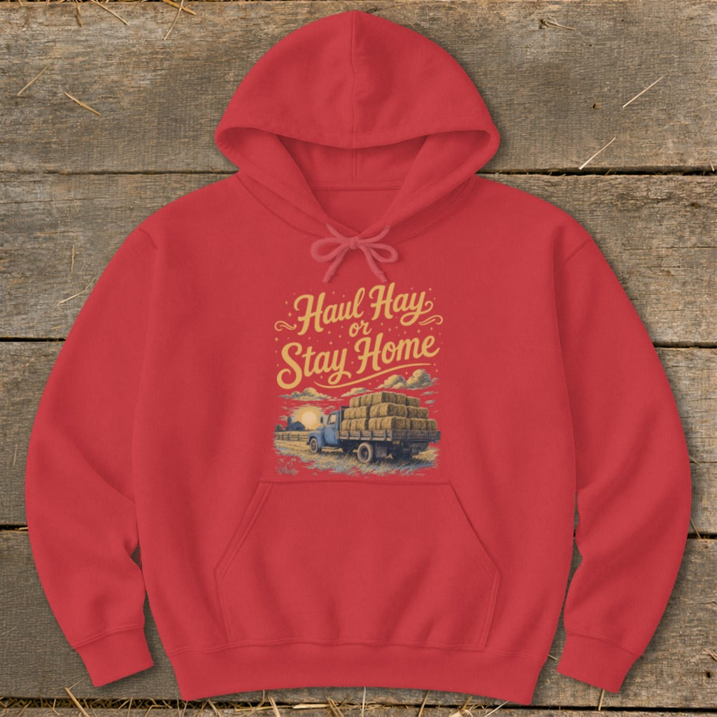 Red hoodie with "Haul Hay or Stay Home" graphic of a truck loaded with hay bales.