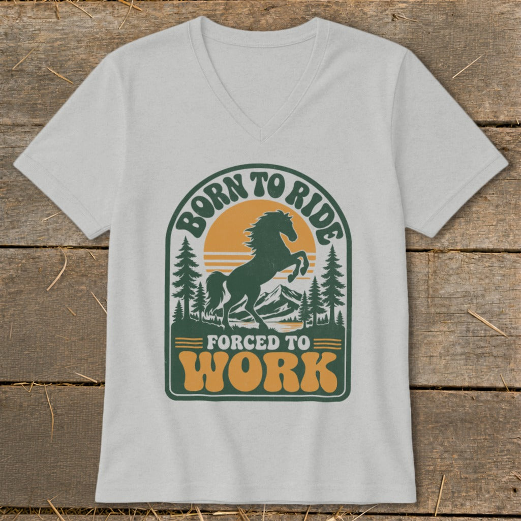 T-shirt with graphic of horse, mountains, trees, and text "BORN TO RIDE FORCED TO WORK."