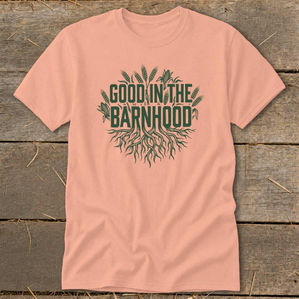Peach t-shirt with green text "GOOD IN THE BARNHHOOD" and roots graphic.