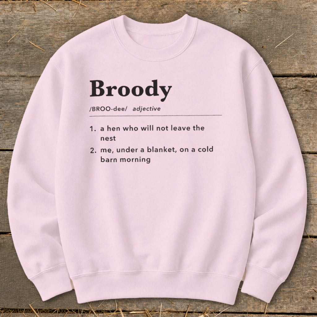 Pink sweatshirt with "Broody" definition: hen in nest, and me under blanket.