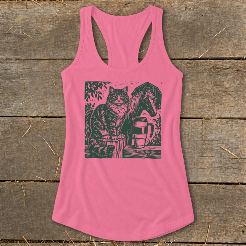 Pink tank top featuring a linocut print of a cat, horse, barn, and mug.