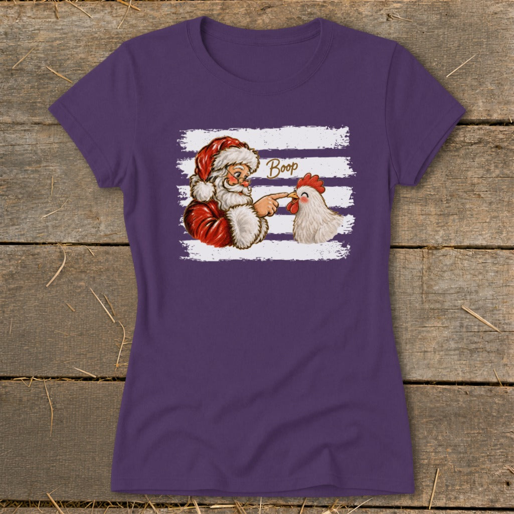 Santa booping a chicken's nose with the word "Boop" above.