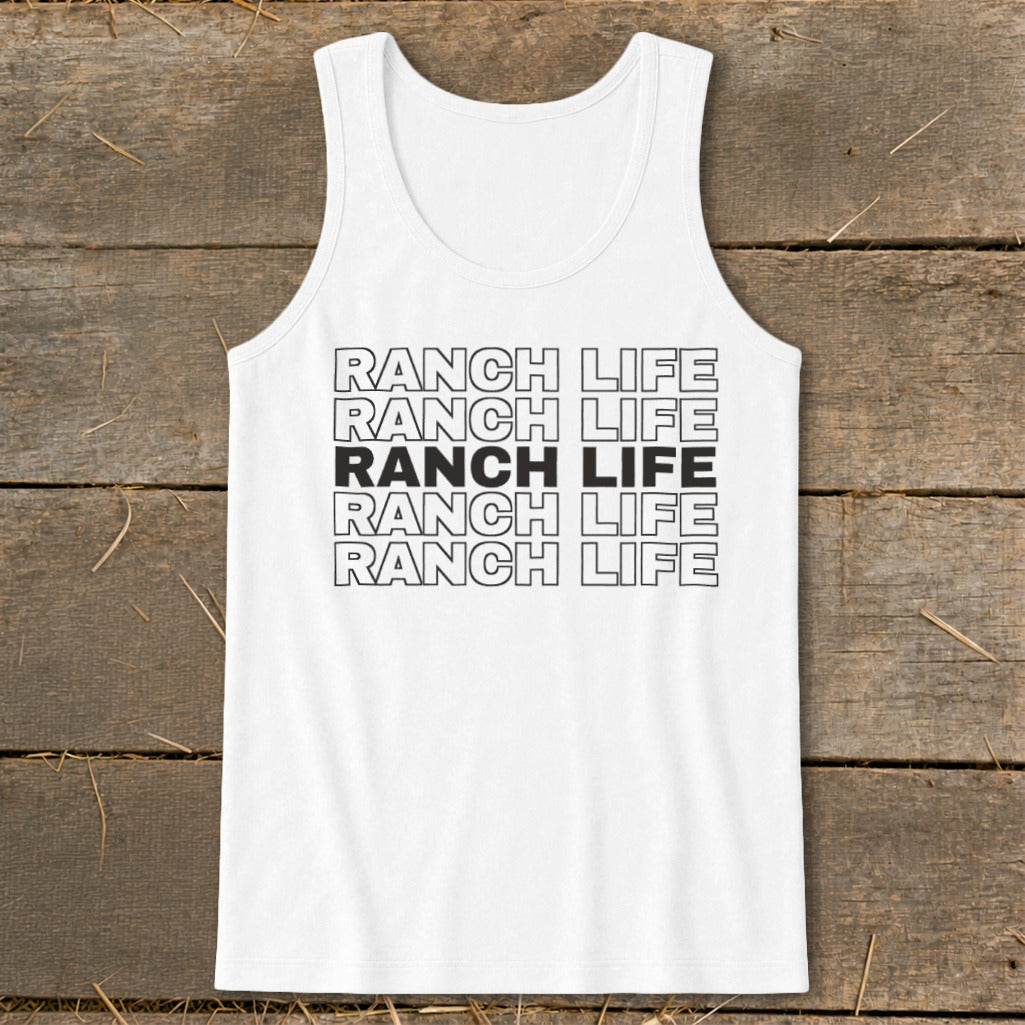 White tank top featuring the repeated text Ranch Life in black outline and solid font against a rustic wooden background.