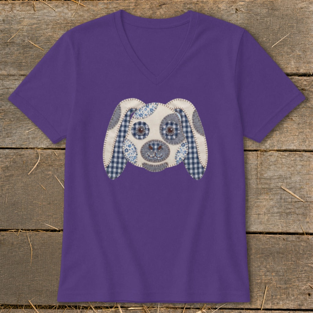 Purple v-neck t-shirt with a patchwork dog face applique.