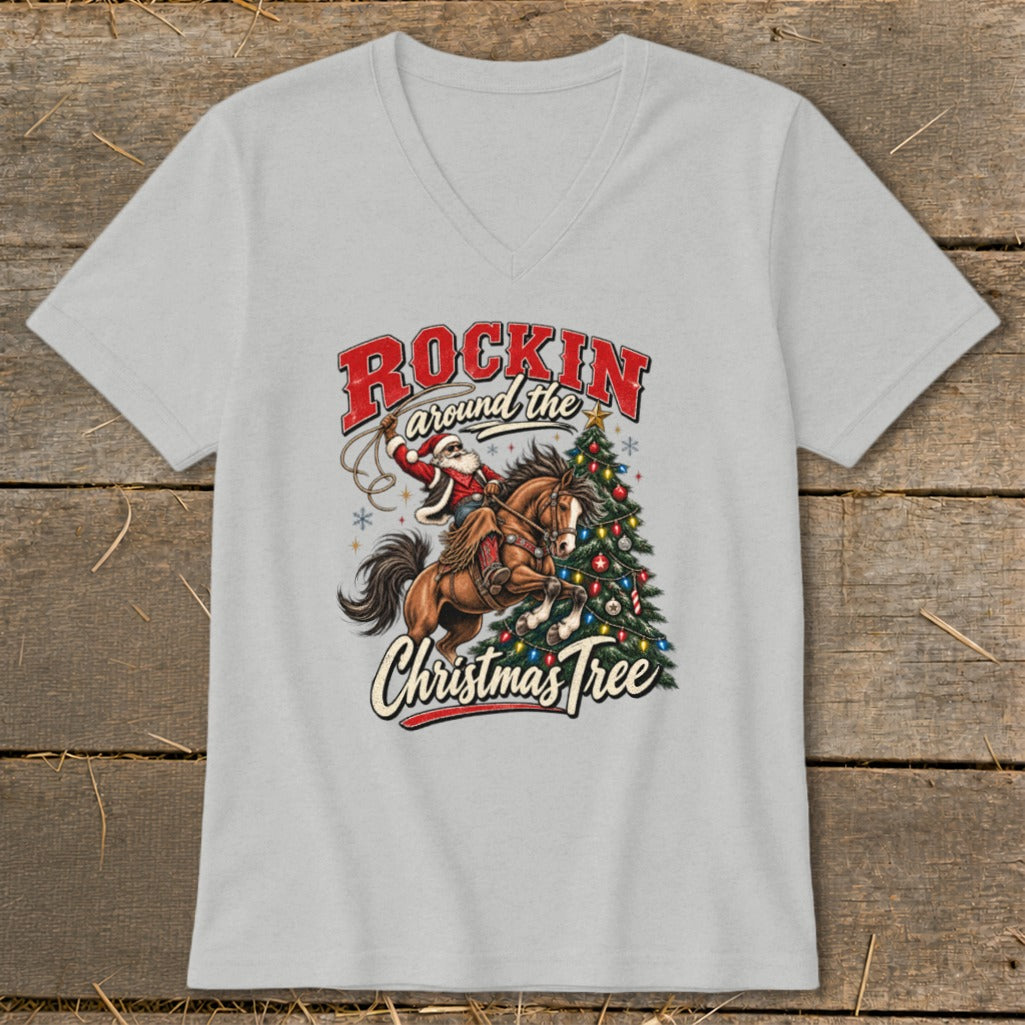 Santa on horseback lassoing a Christmas tree with "Rockin Around the Christmas Tree" text.
