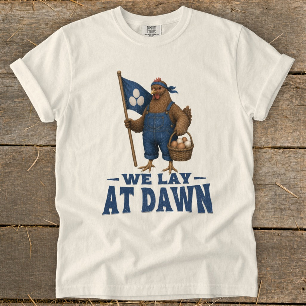 Chicken in overalls holds basket of eggs and flag reading "We Lay At Dawn".