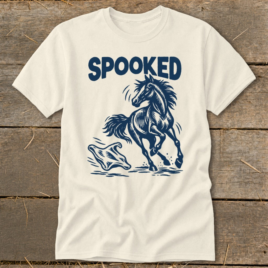 Cream t-shirt with navy blue "SPOOKED" text and a startled horse facing a ghost.
