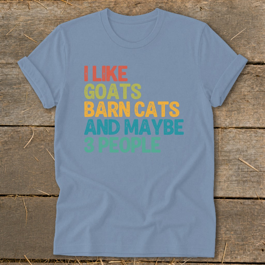 Light blue t-shirt with "I like goats barn cats and maybe 3 people" text.