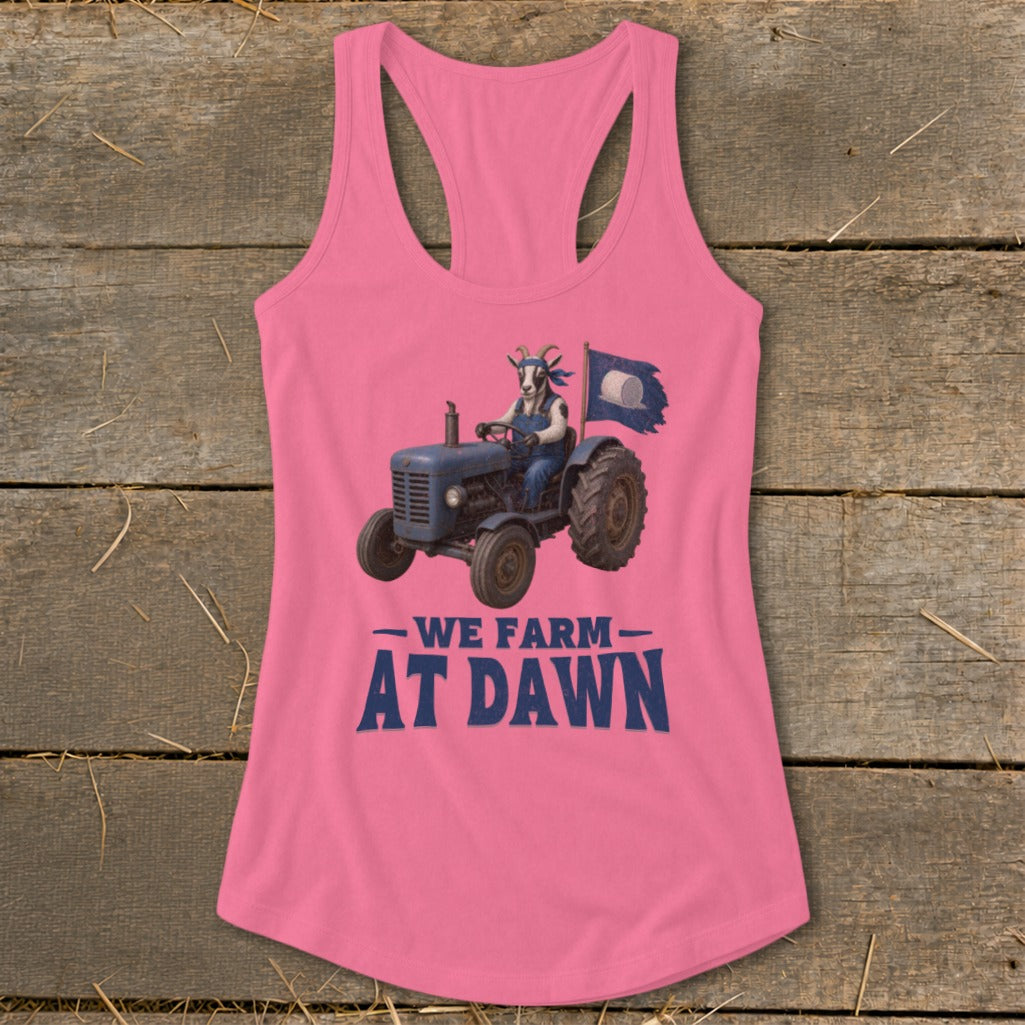 Pink tank top with a goat driving a tractor and the text "We Farm At Dawn".