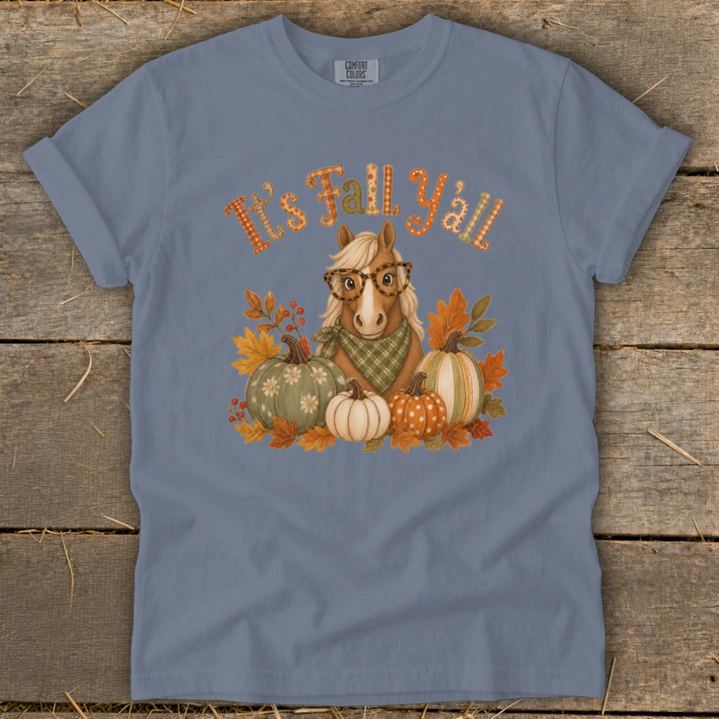 Horse with glasses and pumpkins on a blue t-shirt with "It's Fall Y'all" text.