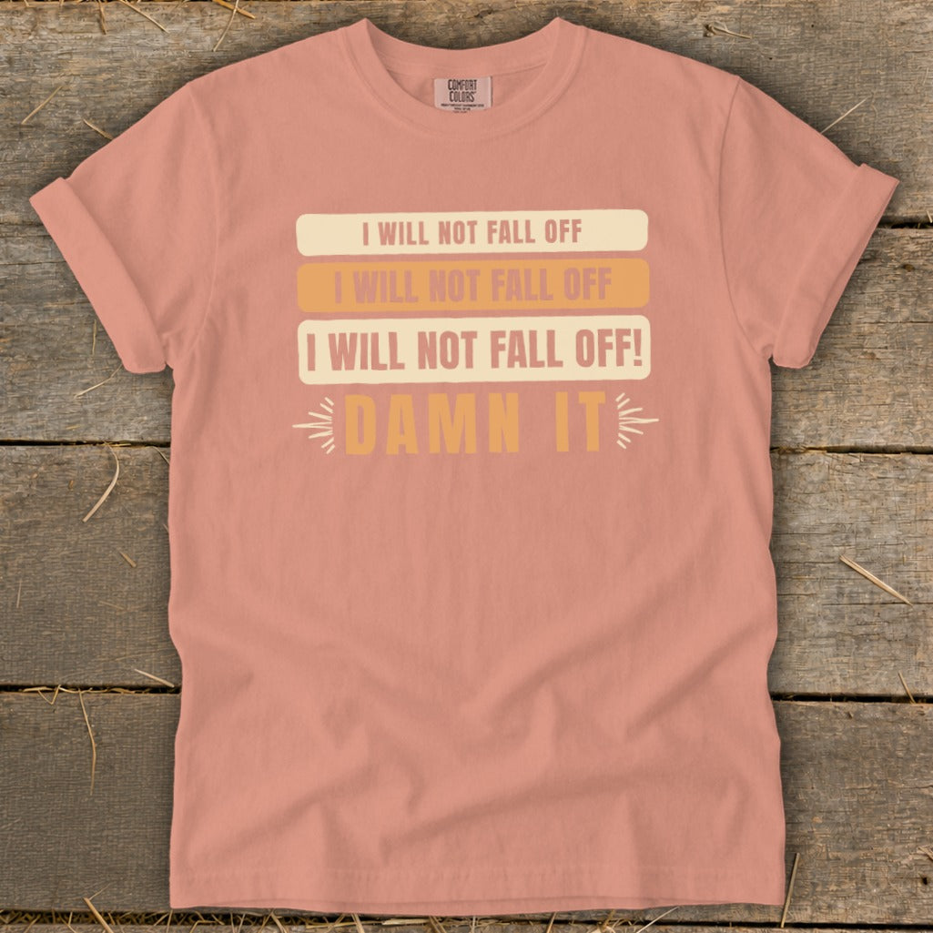 Peach t-shirt with "I Will Not Fall Off" and "Damn It" text.