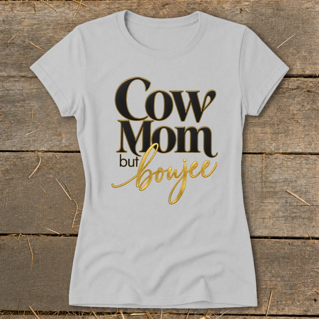 Light gray t-shirt with "Cow Mom but boujee" text in black and gold.
