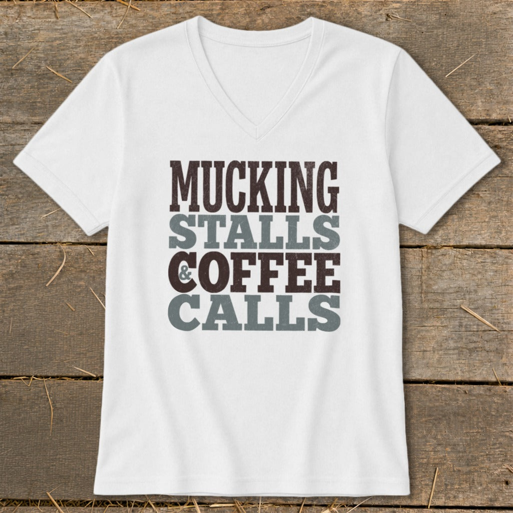 White v-neck t-shirt with "Mucking Stalls & Coffee Calls" text.