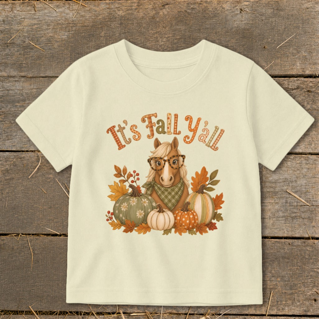 Cream t-shirt with horse, pumpkins, autumn leaves, and "It's Fall Y'all" text.