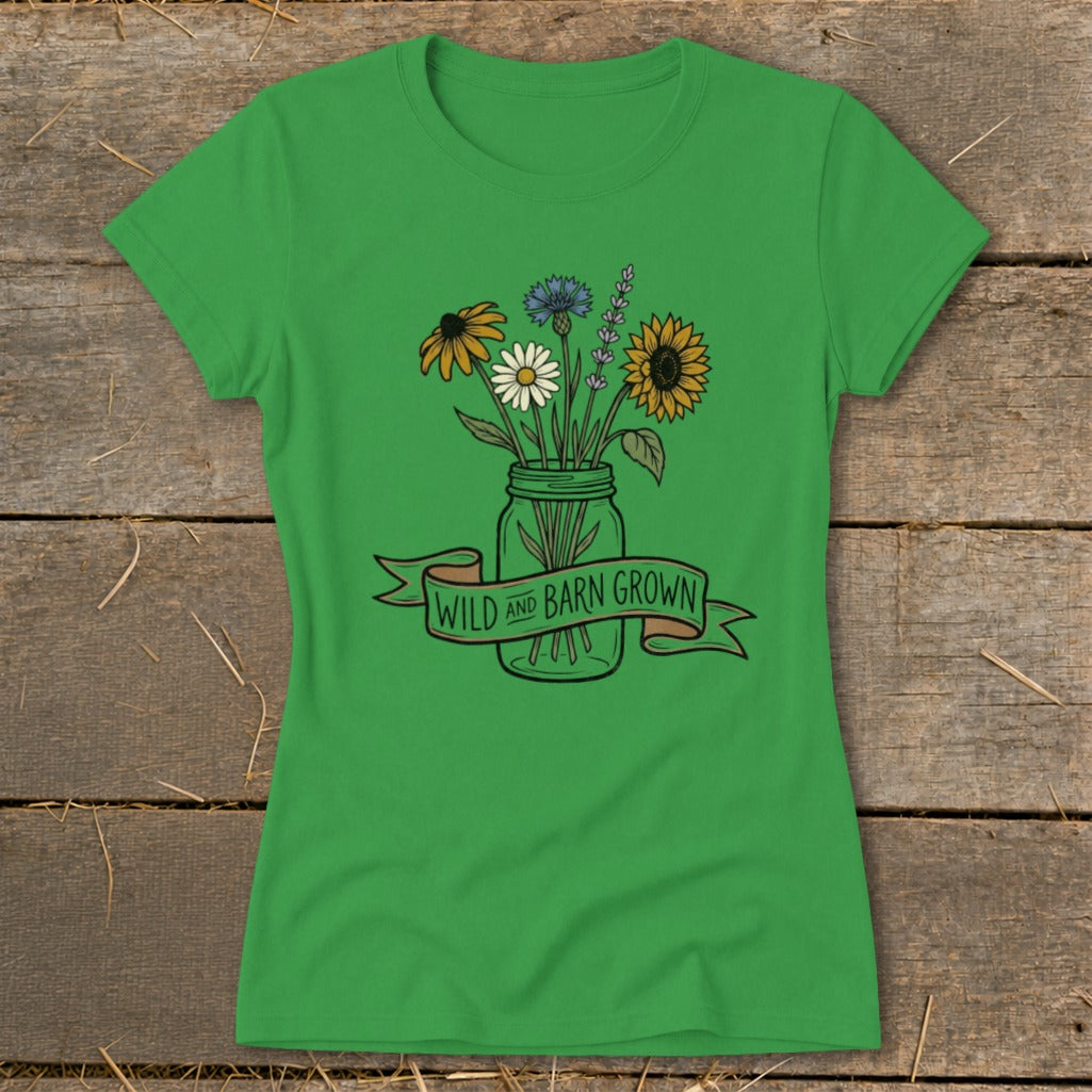 Green t-shirt with "Wild and Barn Grown" text and a bouquet of flowers in a mason jar.