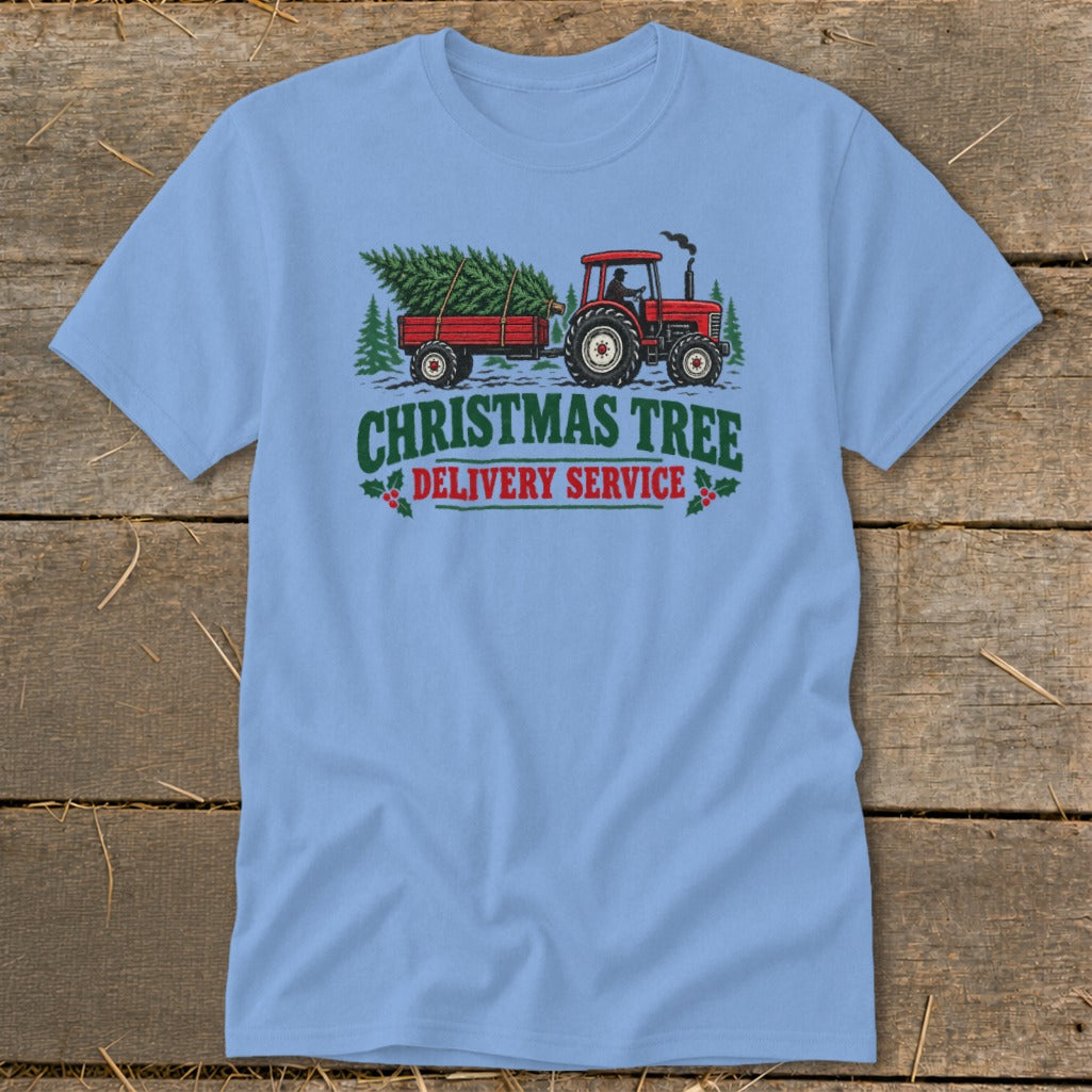 Red tractor pulling trailer with Christmas tree, text reads "Christmas Tree Delivery Service".