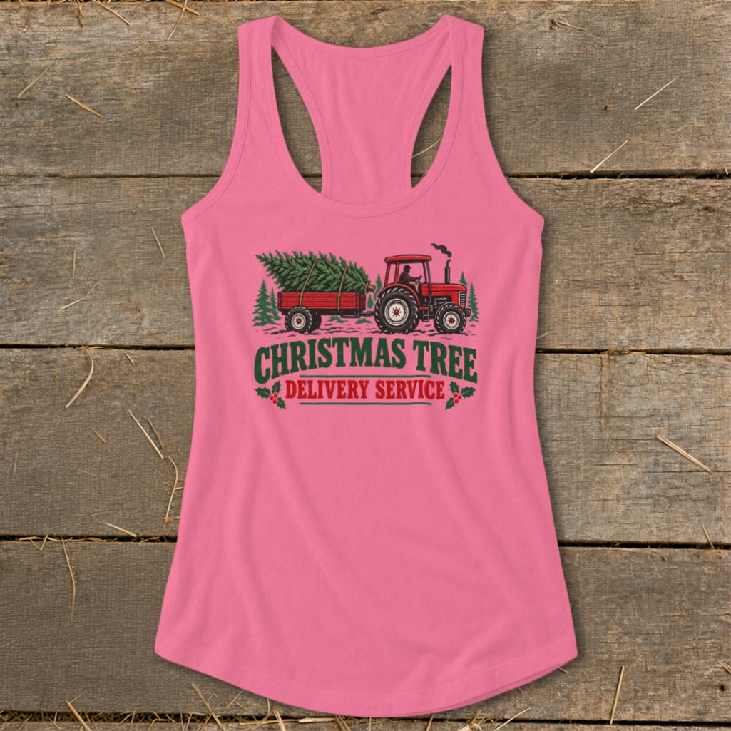 Pink tank top with Christmas tree delivery service graphic featuring a tractor and trailer.