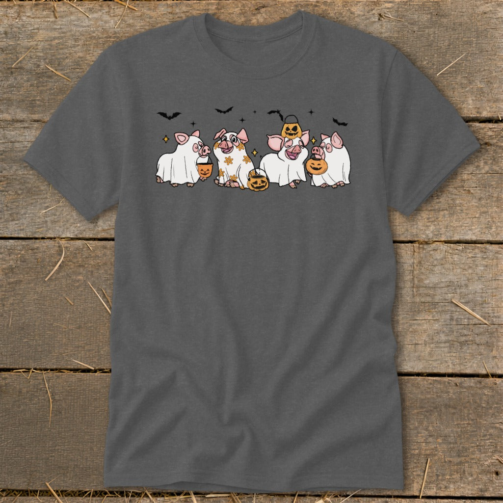 Four pigs in ghost costumes hold pumpkins and wear Halloween decorations.