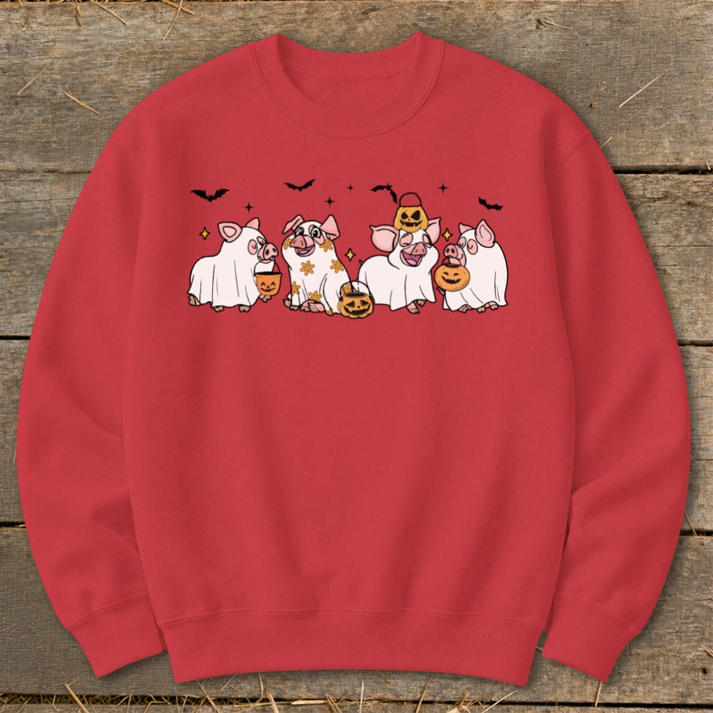 Four cartoon pigs in ghost costumes hold pumpkin buckets, with bats and stars in the background.