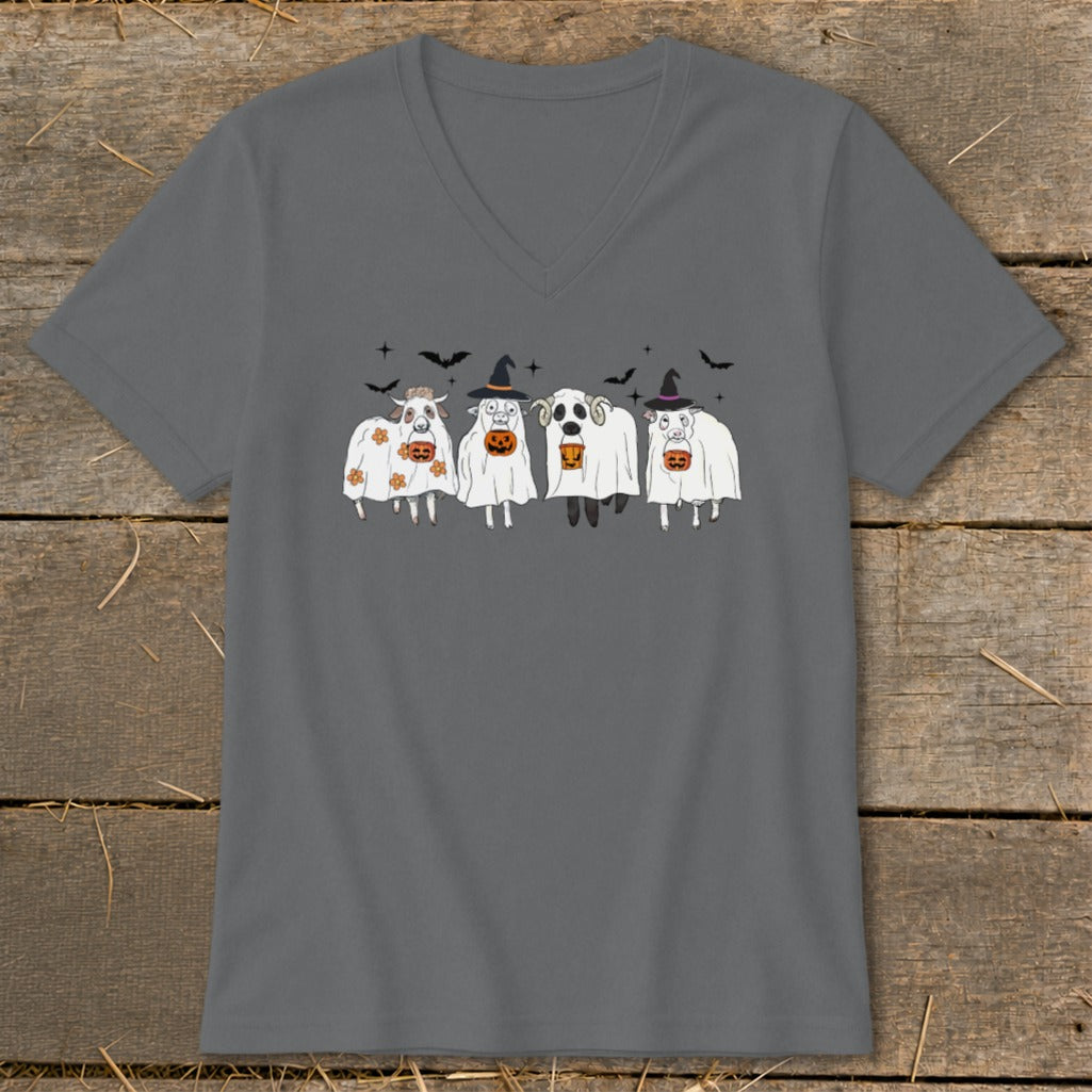 Four farm animals dressed in Halloween costumes and holding pumpkins on a grey t-shirt.