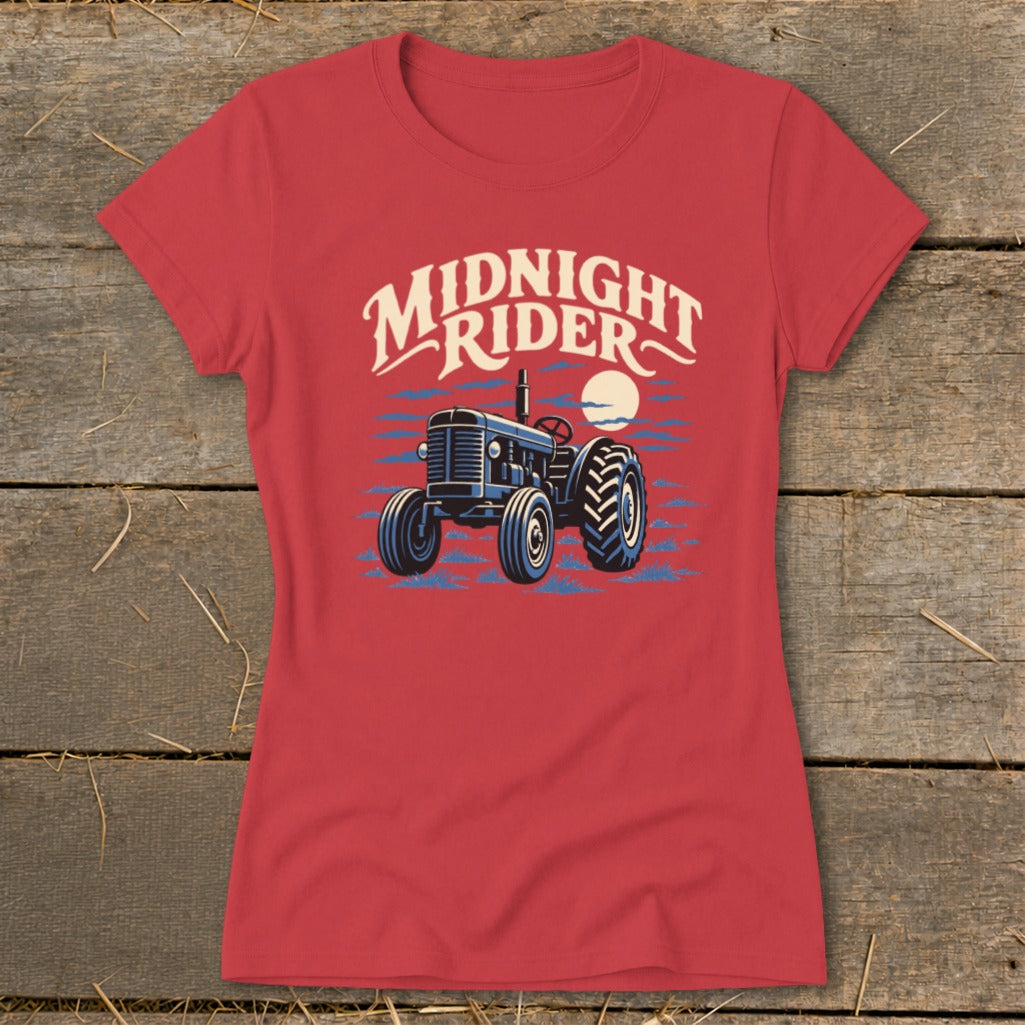 Red women's t-shirt featuring a graphic of a blue tractor and the text Midnight Rider.