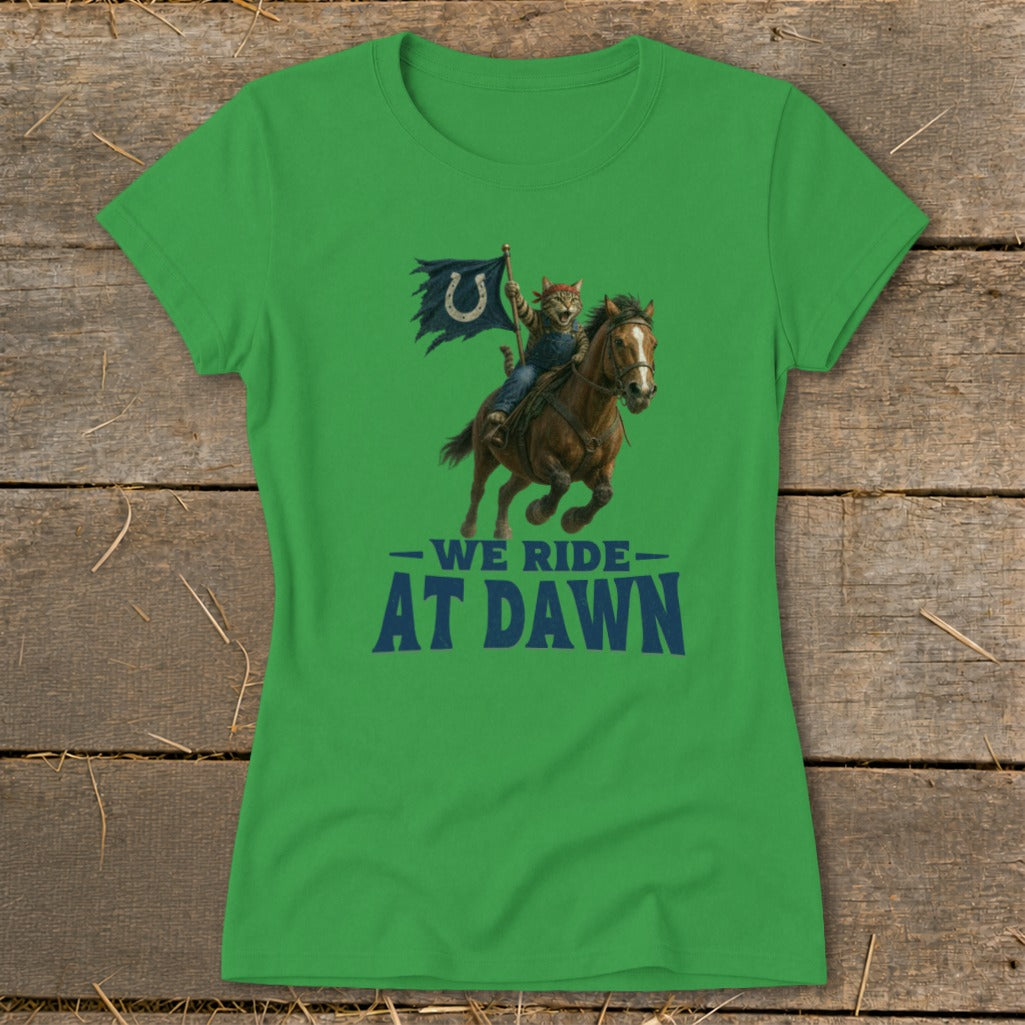 Green t-shirt featuring a cat riding a horse, holding a flag with a horseshoe logo, with text "We Ride At Dawn".