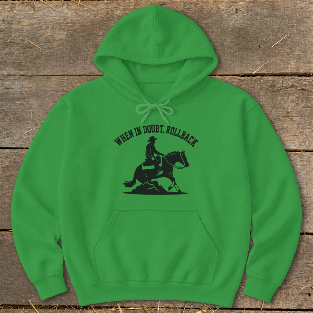 Green hoodie with a black silhouette of a cowboy on a horse and the text "When in doubt, rollback".
