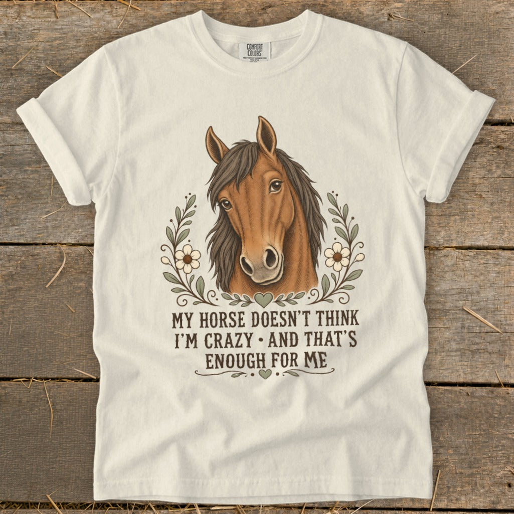 White t-shirt with horse illustration and "My horse doesn't think I'm crazy" text.