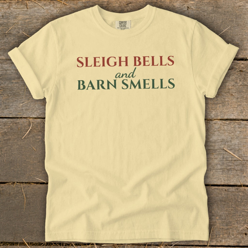 Light yellow t-shirt with "Sleigh Bells and Barn Smells" text.